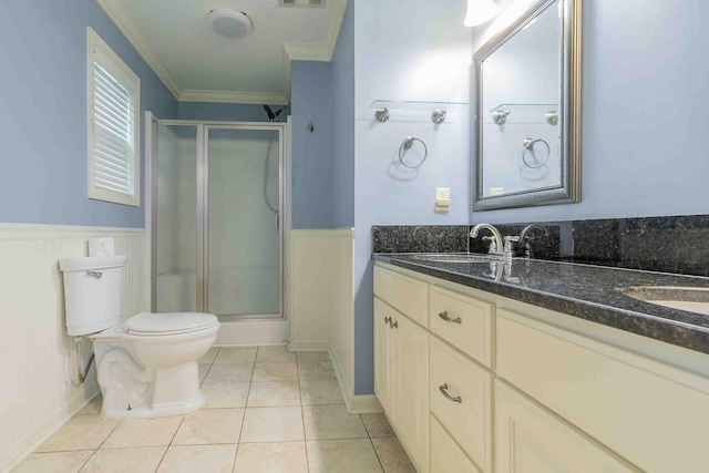 full bath with a sink, ornamental molding, a shower stall, and double vanity
