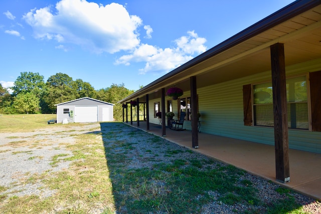 view of yard featuring an outbuilding and a patio area