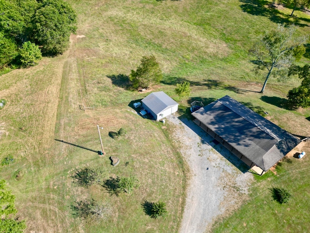 birds eye view of property with a rural view