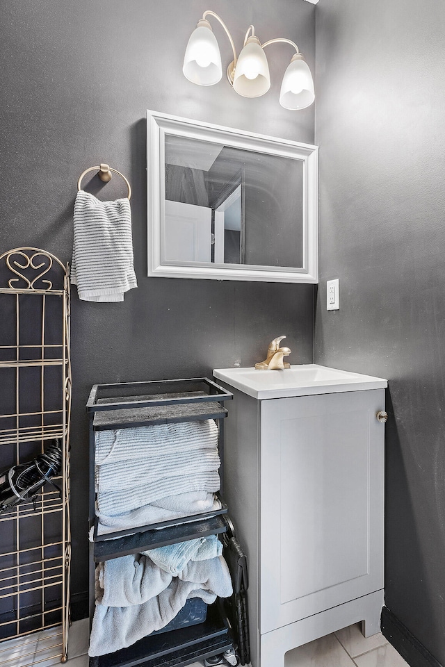 bathroom with sink and tile patterned flooring