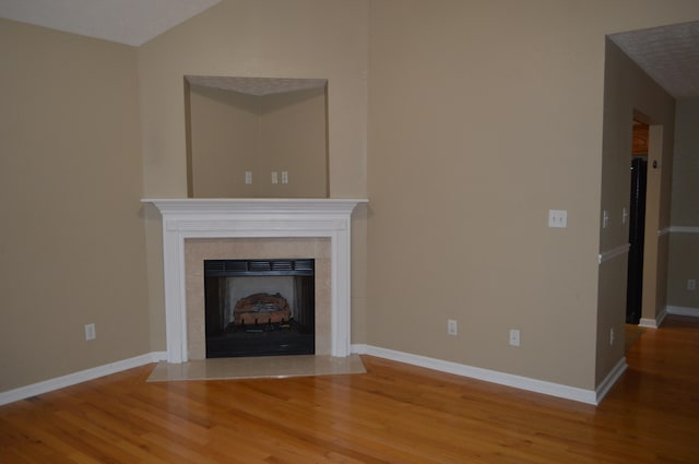 unfurnished living room with hardwood / wood-style flooring