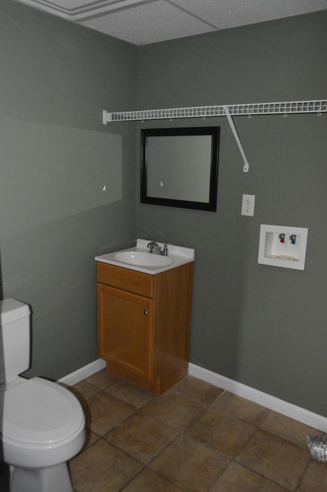 bathroom featuring vanity, toilet, and tile patterned floors