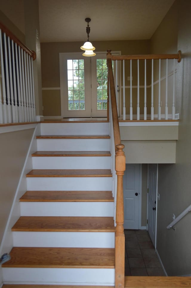 staircase with tile patterned floors