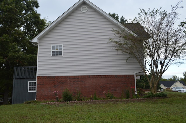 view of property exterior with a yard