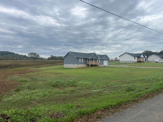 view of front of house with a rural view