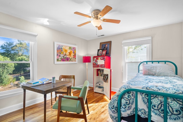 bedroom with hardwood / wood-style flooring and ceiling fan