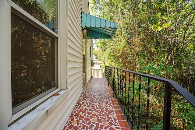 view of side of property featuring a balcony