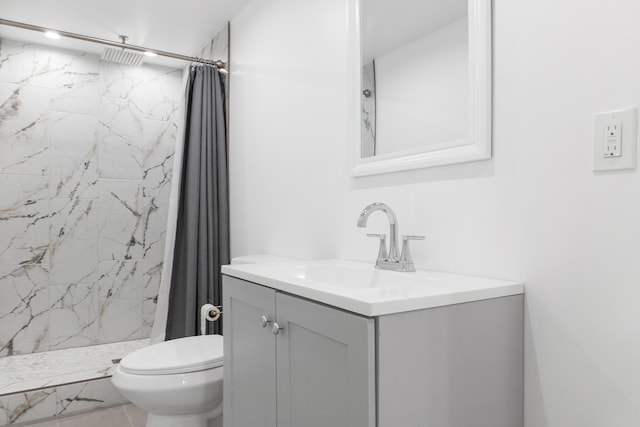 bathroom featuring vanity, curtained shower, and toilet