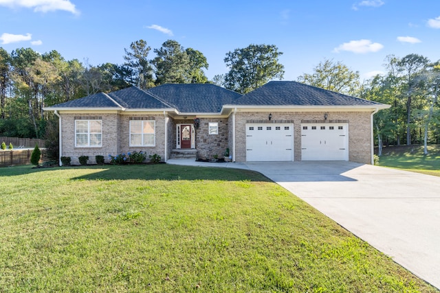 ranch-style house featuring a garage and a front lawn