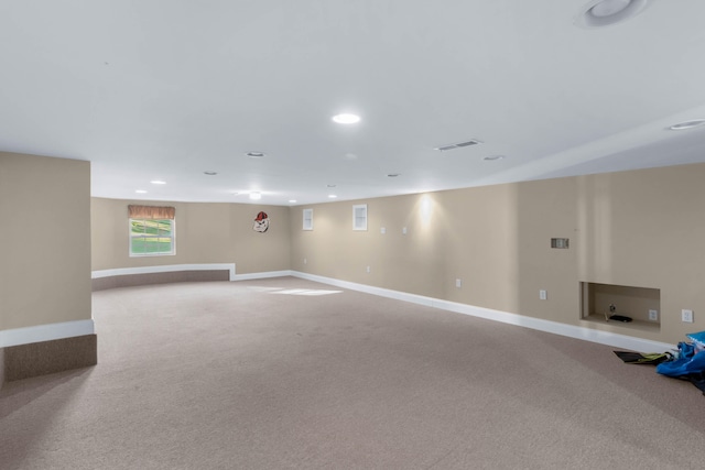 basement with light colored carpet