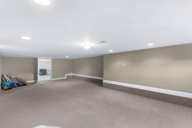 basement featuring carpet flooring