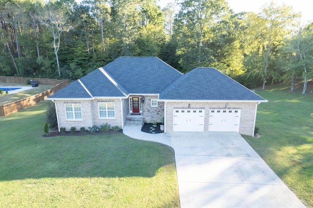 view of front of property with a front lawn and a garage