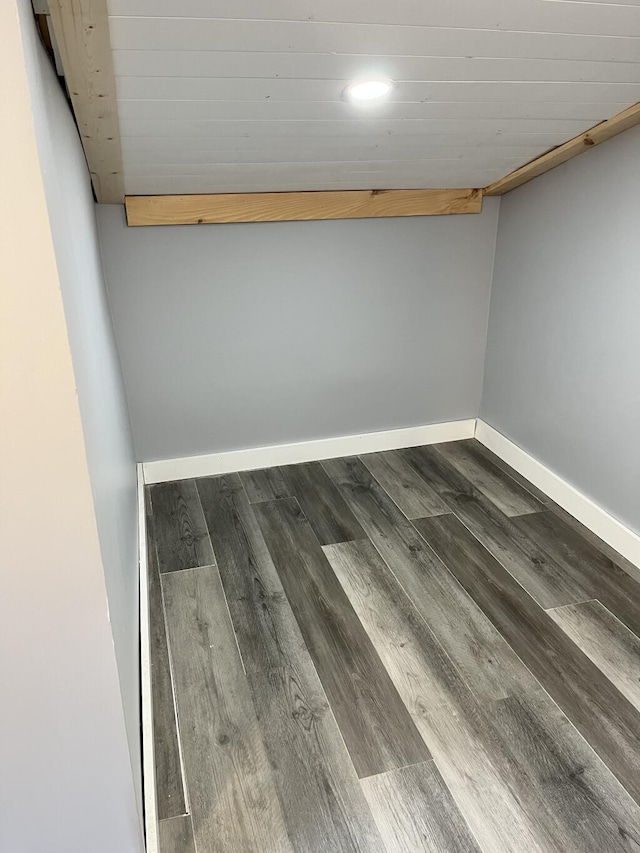 empty room with dark hardwood / wood-style floors