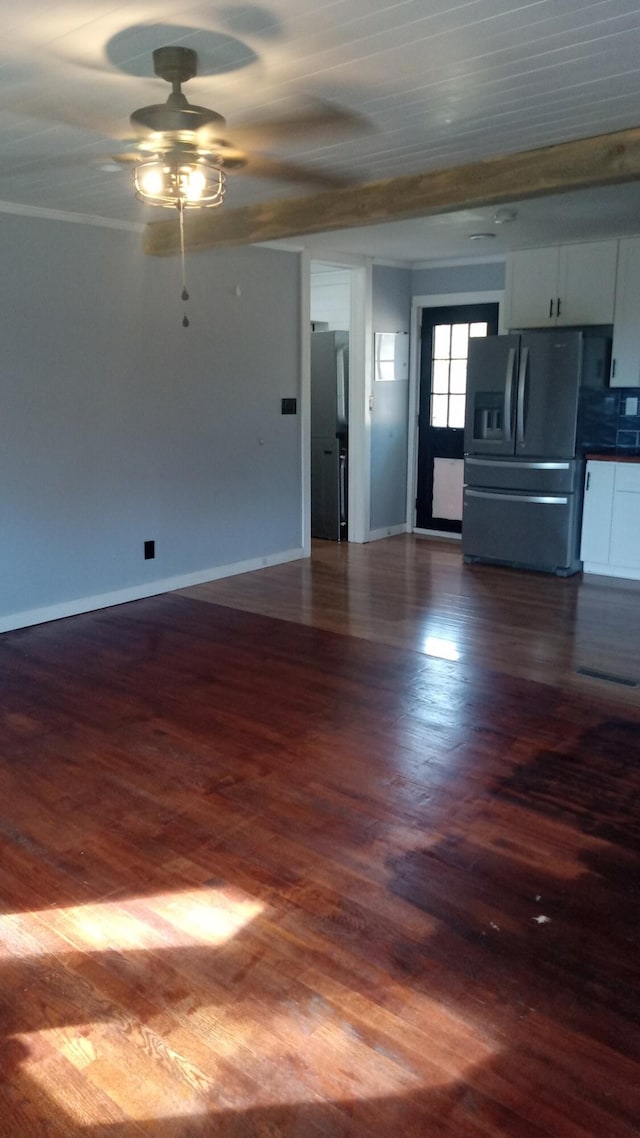 unfurnished living room with ceiling fan, dark hardwood / wood-style floors, and ornamental molding