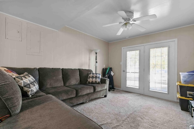 living room featuring french doors, carpet, and ceiling fan