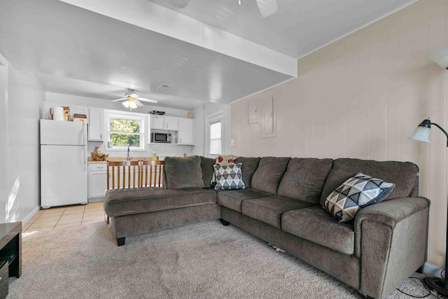 living room featuring ceiling fan and light colored carpet