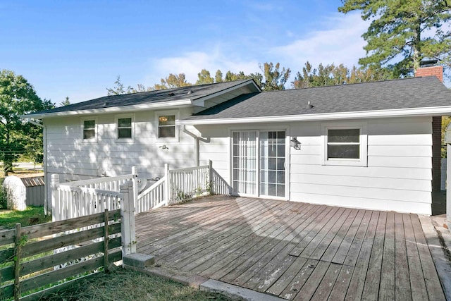 rear view of house featuring a deck