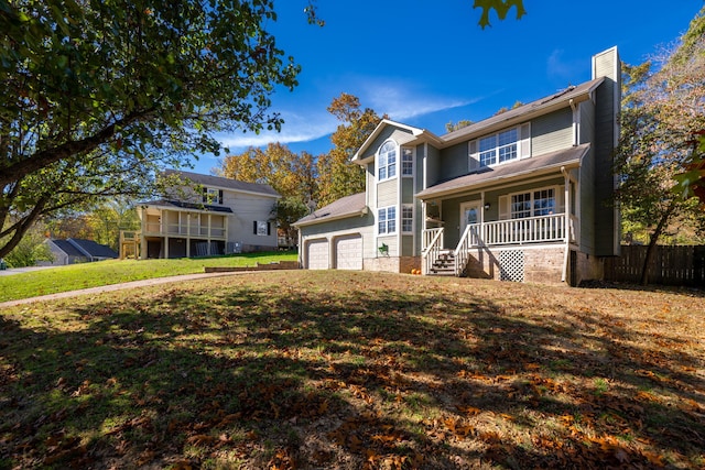 view of property featuring a front yard and covered porch