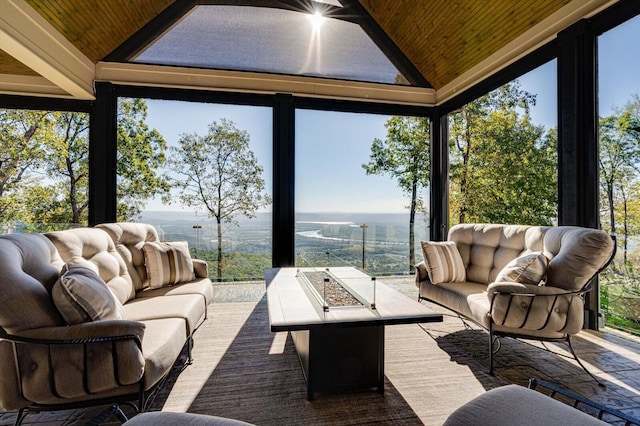 sunroom featuring plenty of natural light, wooden ceiling, and vaulted ceiling