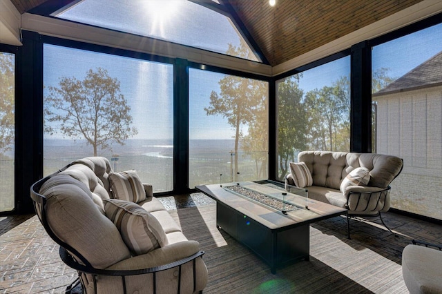 sunroom / solarium featuring vaulted ceiling and wood ceiling