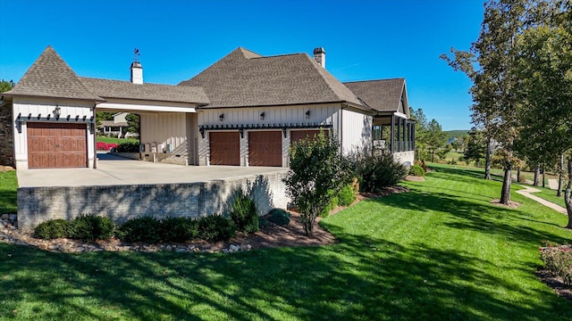 view of home's exterior featuring a garage and a lawn