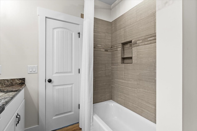 bathroom featuring shower / bath combo, vanity, and hardwood / wood-style flooring