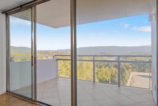 interior space featuring a mountain view and a healthy amount of sunlight