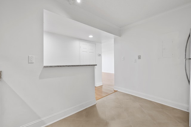 tiled empty room with ornamental molding