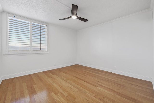 spare room with crown molding, a textured ceiling, light wood-type flooring, and ceiling fan