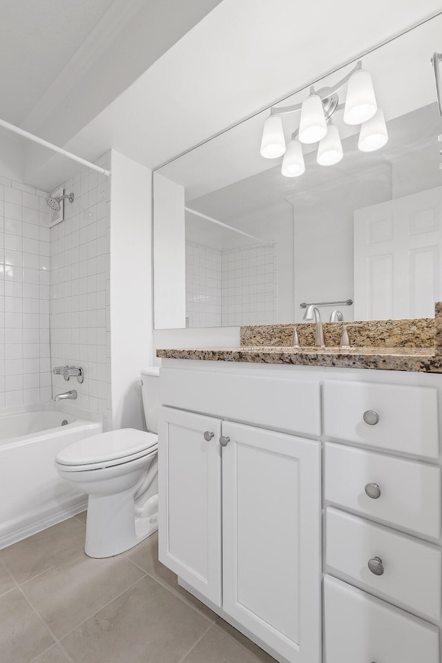 full bathroom with vanity, tiled shower / bath combo, toilet, and tile patterned floors