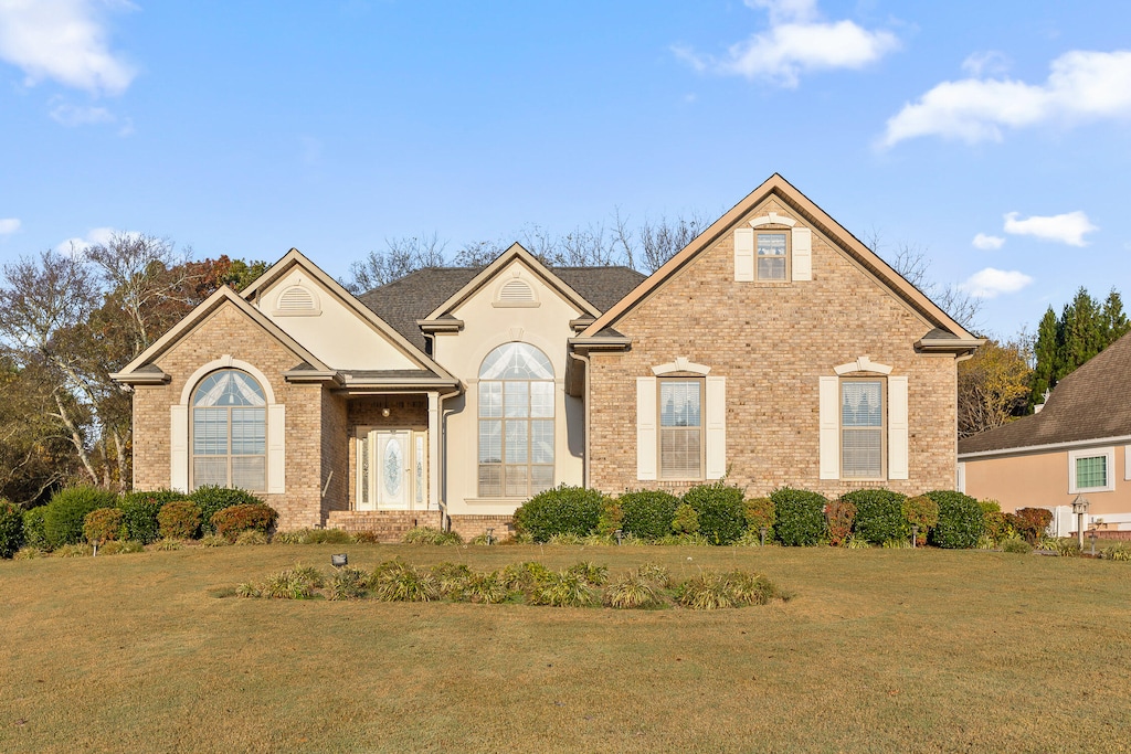 front facade with a front lawn