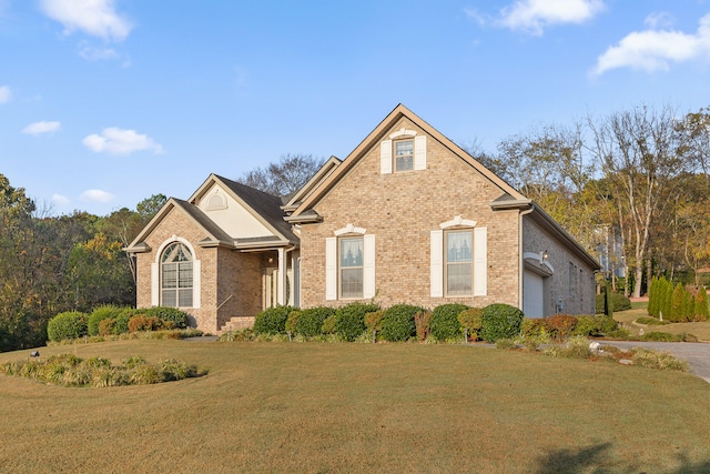 view of front property featuring a front yard and a garage