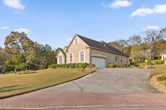 view of home's exterior featuring a yard and a garage