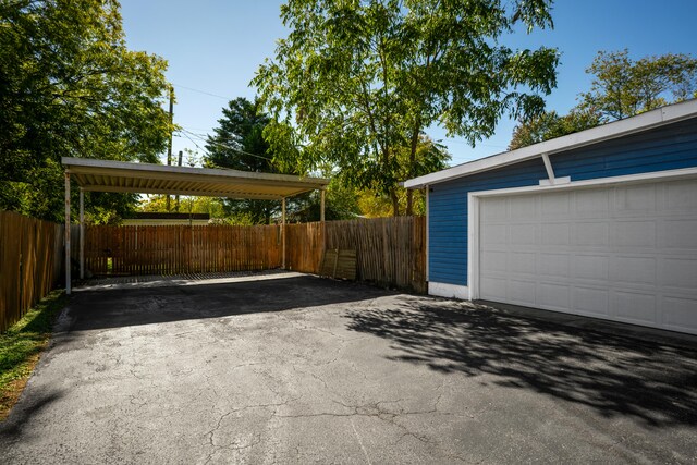 garage featuring a carport