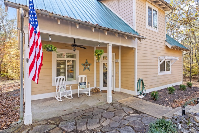 property entrance featuring a porch and ceiling fan