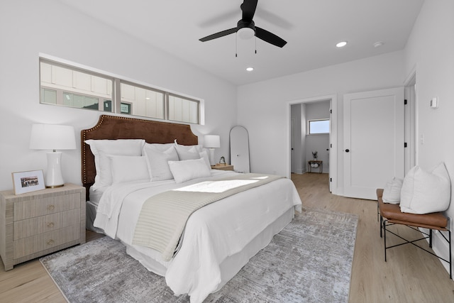 bedroom featuring light hardwood / wood-style flooring and ceiling fan