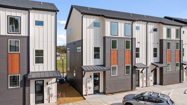 back of property featuring central air condition unit