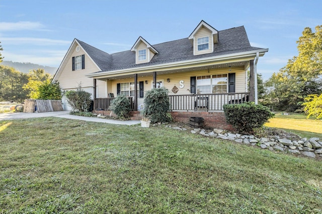 cape cod-style house with a front yard and covered porch