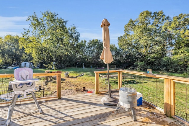 wooden deck with a lawn