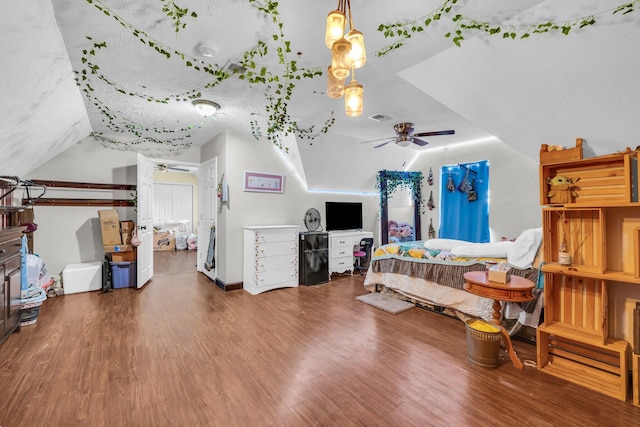 bedroom with lofted ceiling and hardwood / wood-style floors