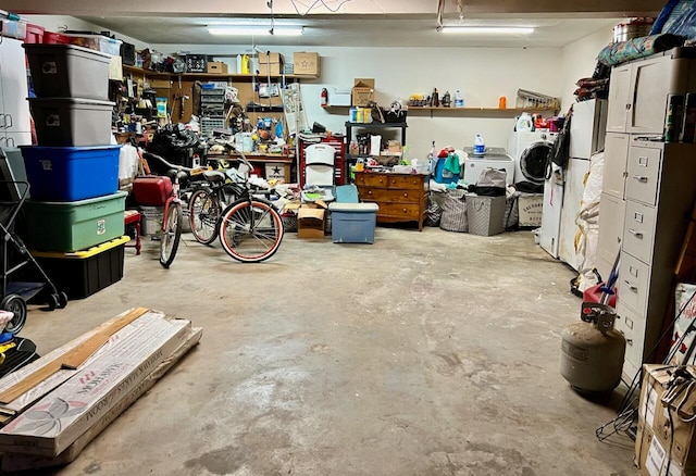 garage with white fridge and a workshop area