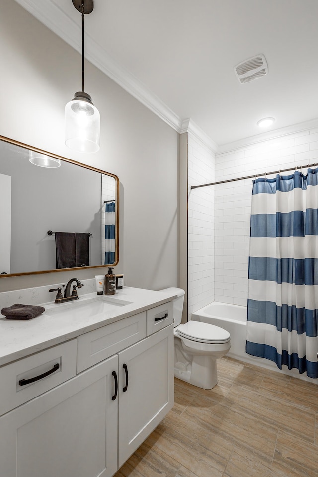 full bathroom with vanity, crown molding, shower / tub combo, and toilet