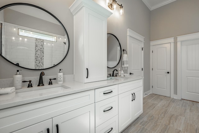 bathroom with vanity, a shower, and ornamental molding