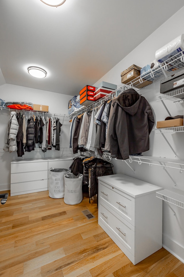 spacious closet featuring light wood-type flooring