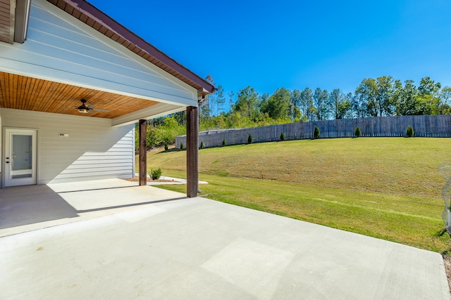 view of yard with a patio area and ceiling fan