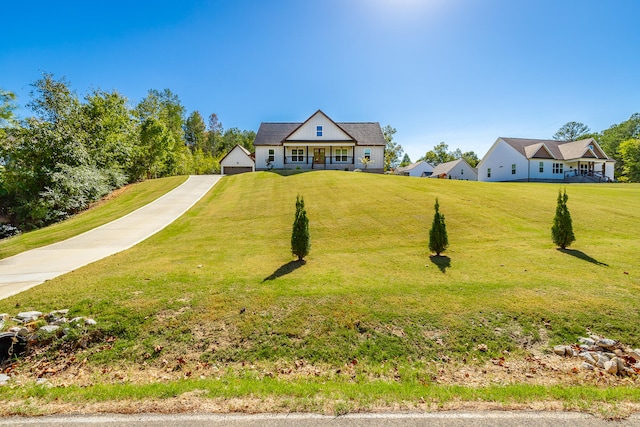 view of front of house featuring a front lawn and a porch