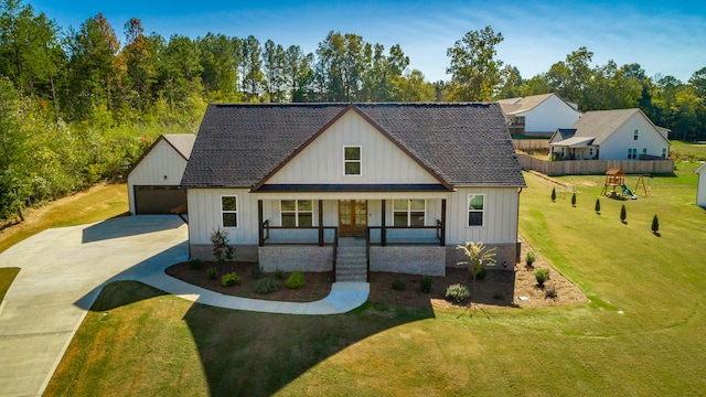 modern inspired farmhouse with covered porch, a playground, a front lawn, and a garage