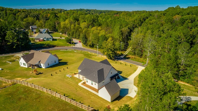 birds eye view of property with a rural view