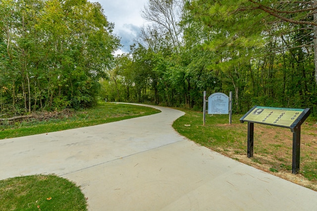 surrounding community featuring a yard