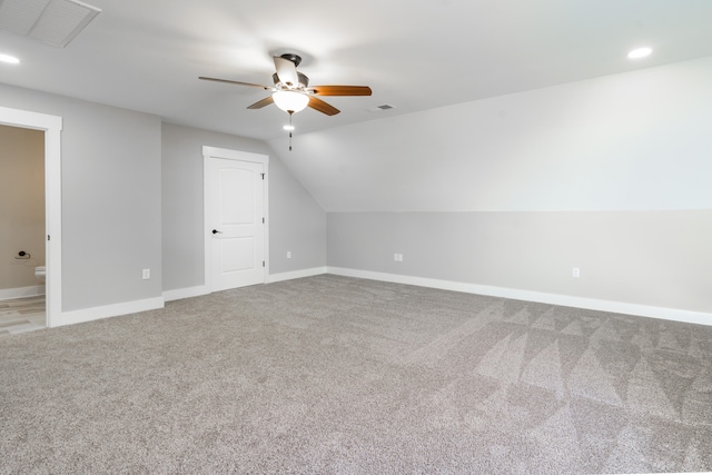 bonus room with lofted ceiling, carpet floors, and ceiling fan